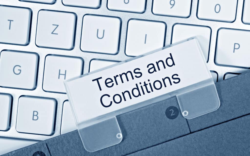 Terms and conditions document on keyboard
